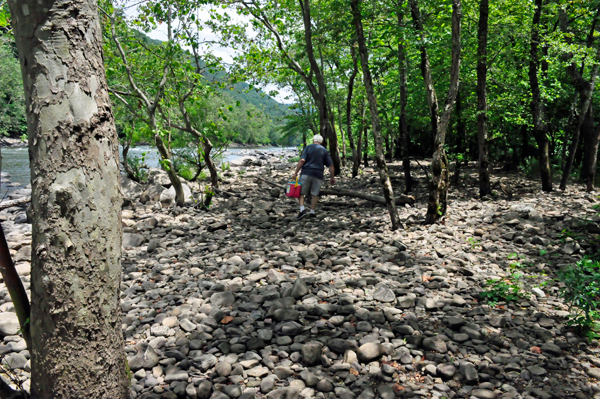 Lee Duquette walking on the rocks